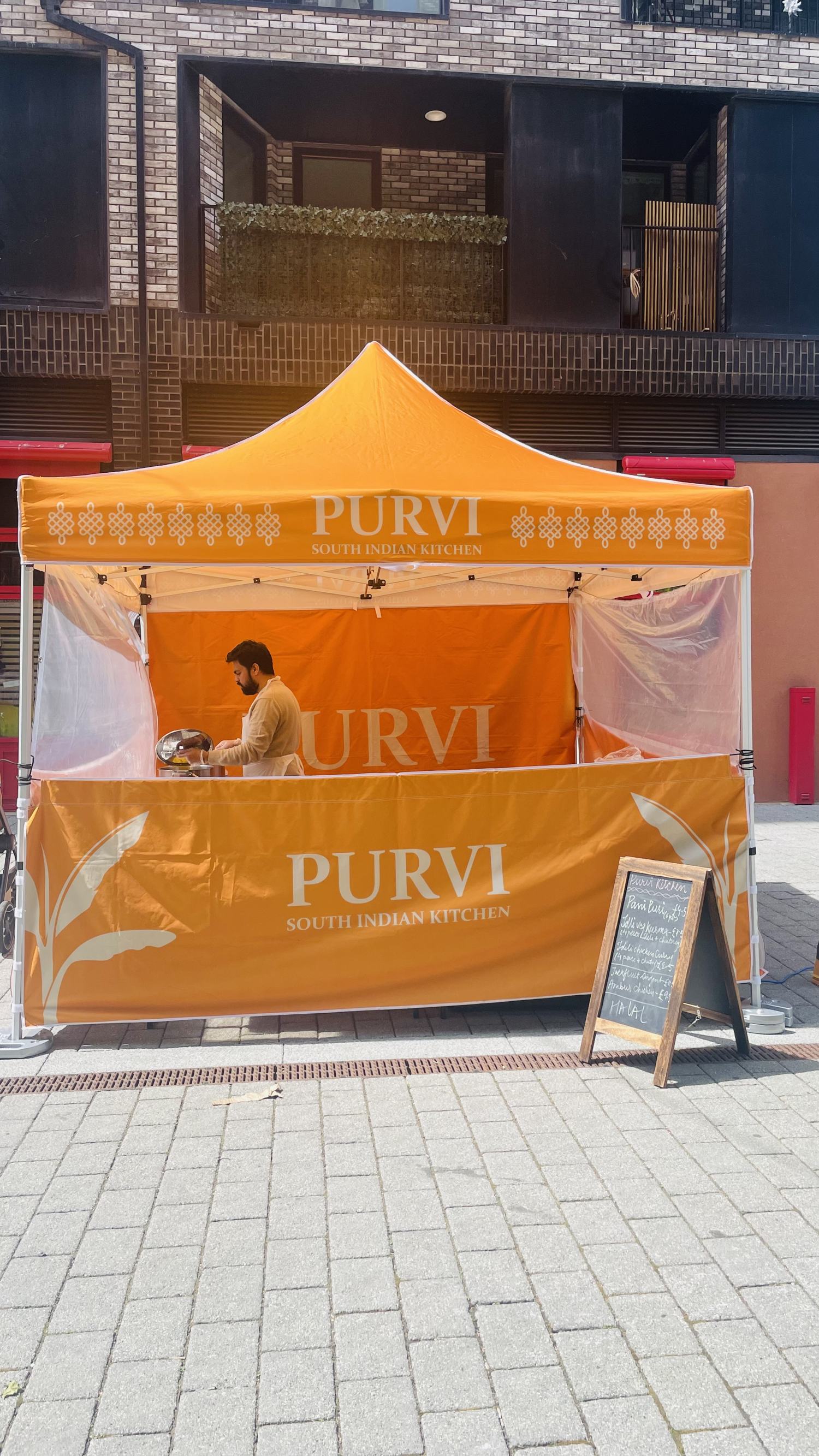 The orange Purvi South Indian Kitchen gazebo in E14